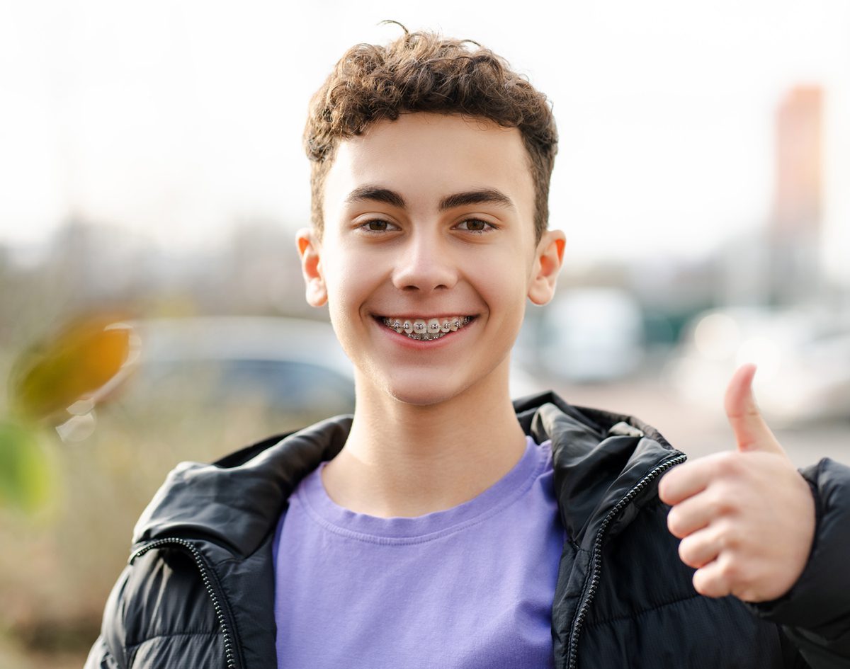 boy-with-braces-thumbs-up